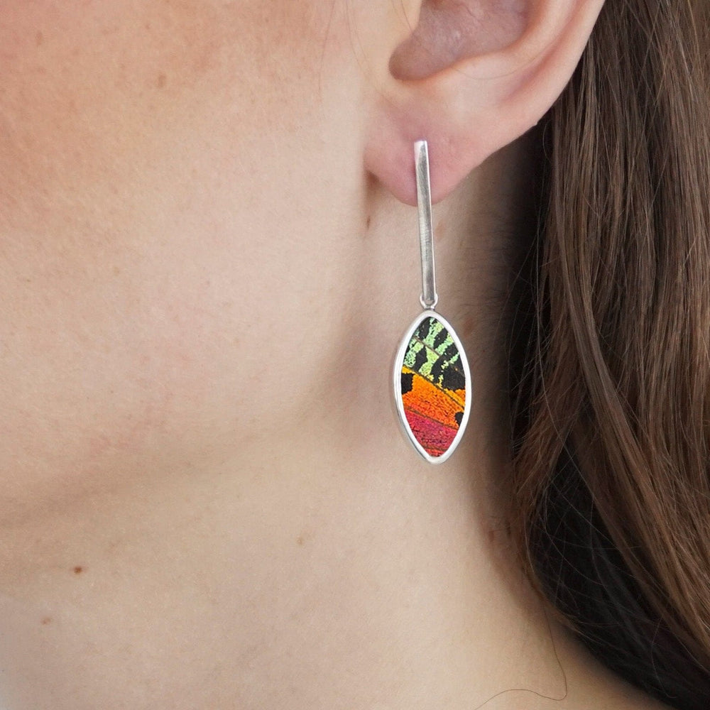 
                  
                    My Store Earrings Oval Pendant Earrings on Flat Bar Post | Real Urania Ripheus Butterfly - Sunset Series | Sterling Silver
                  
                