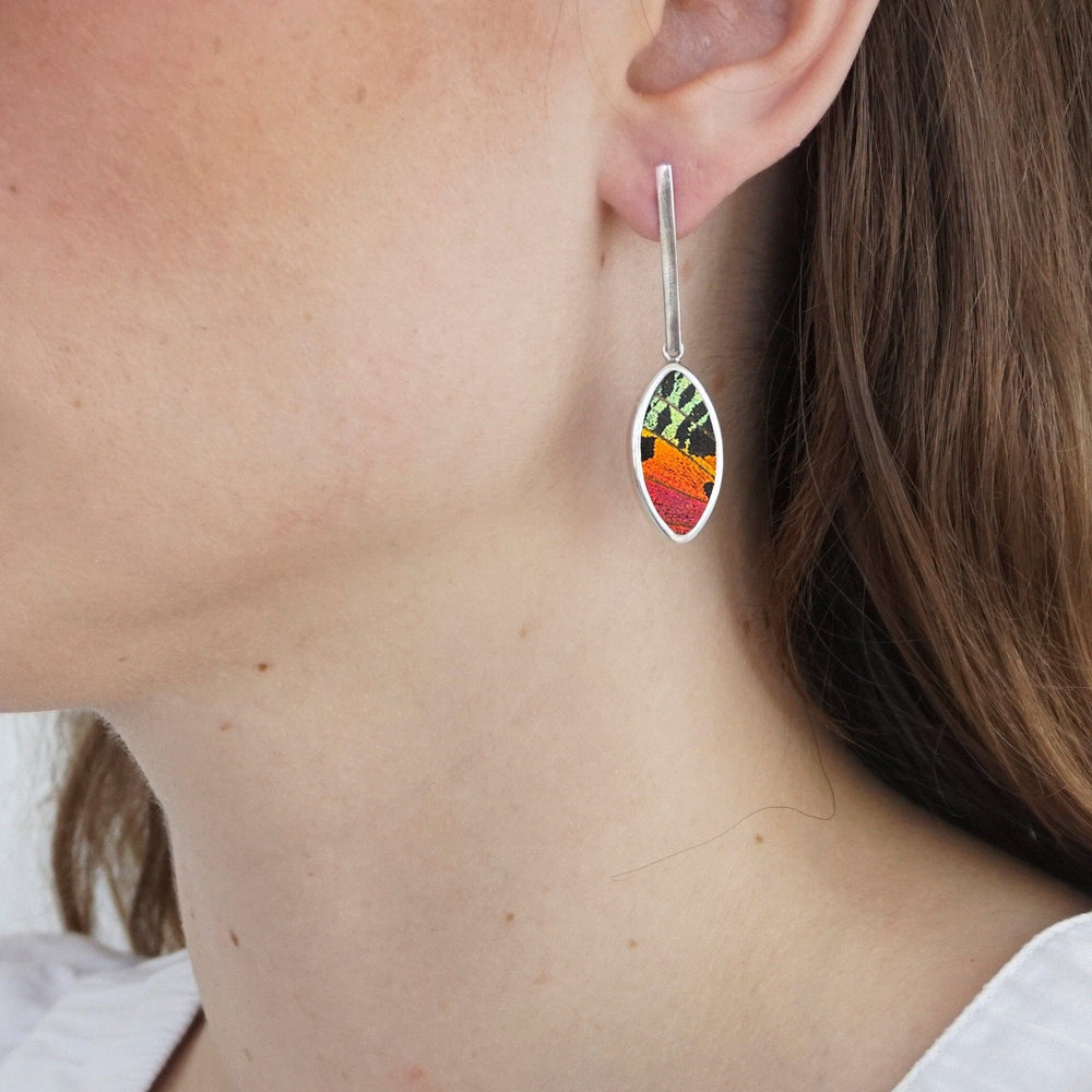 
                  
                    My Store Earrings Oval Pendant Earrings on Flat Bar Post | Real Urania Ripheus Butterfly - Sunset Series | Sterling Silver
                  
                
